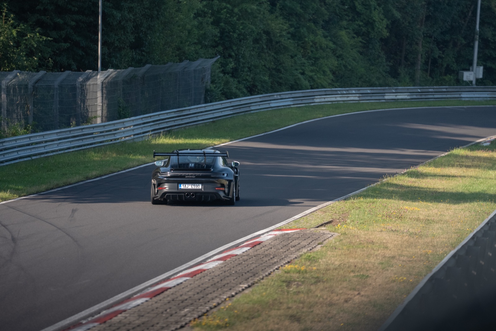 Black Porsche GT3 RS from behind on the Nürburgring