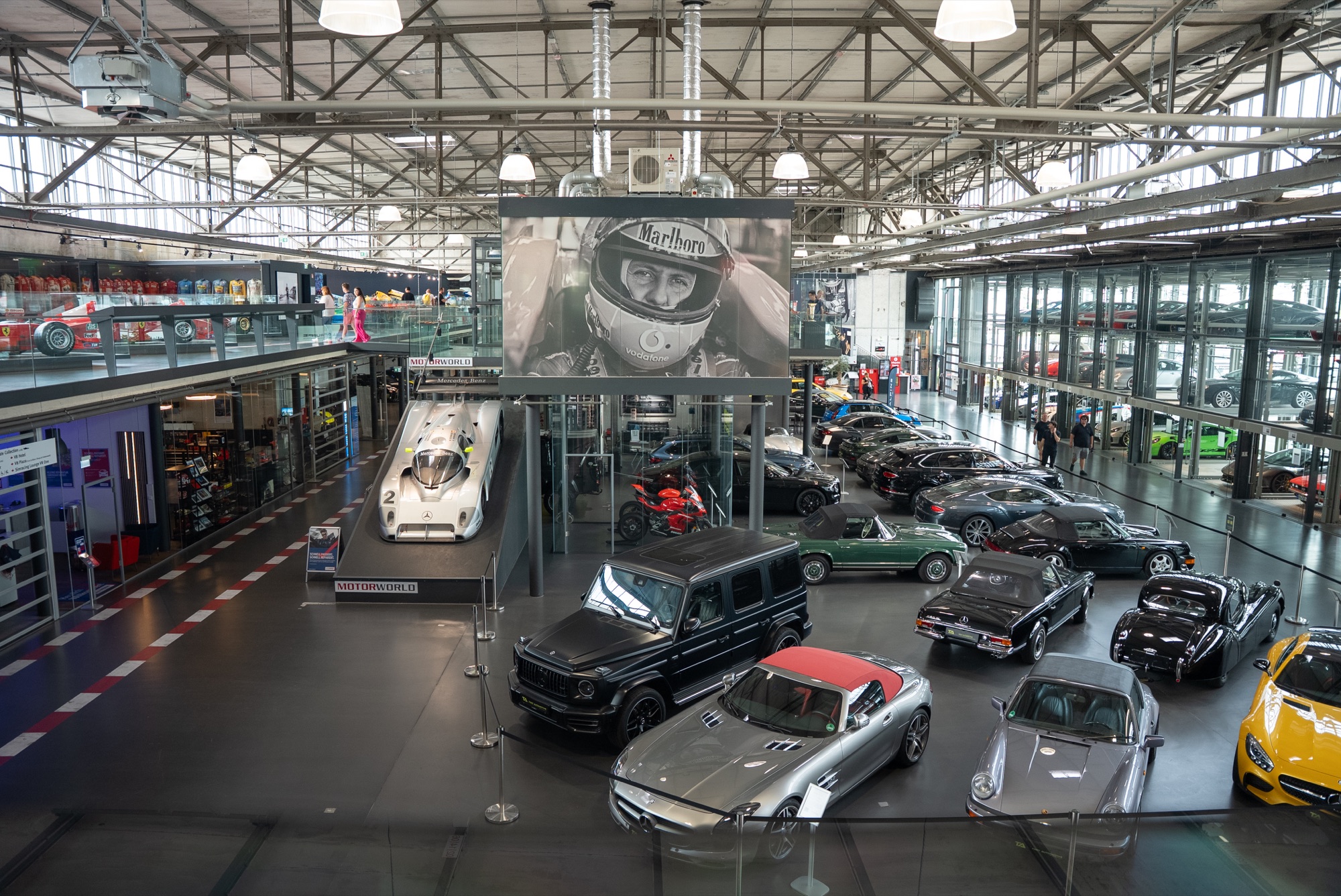 Motorworld hall from the gallery, Marlboro portrait and a floor of cars