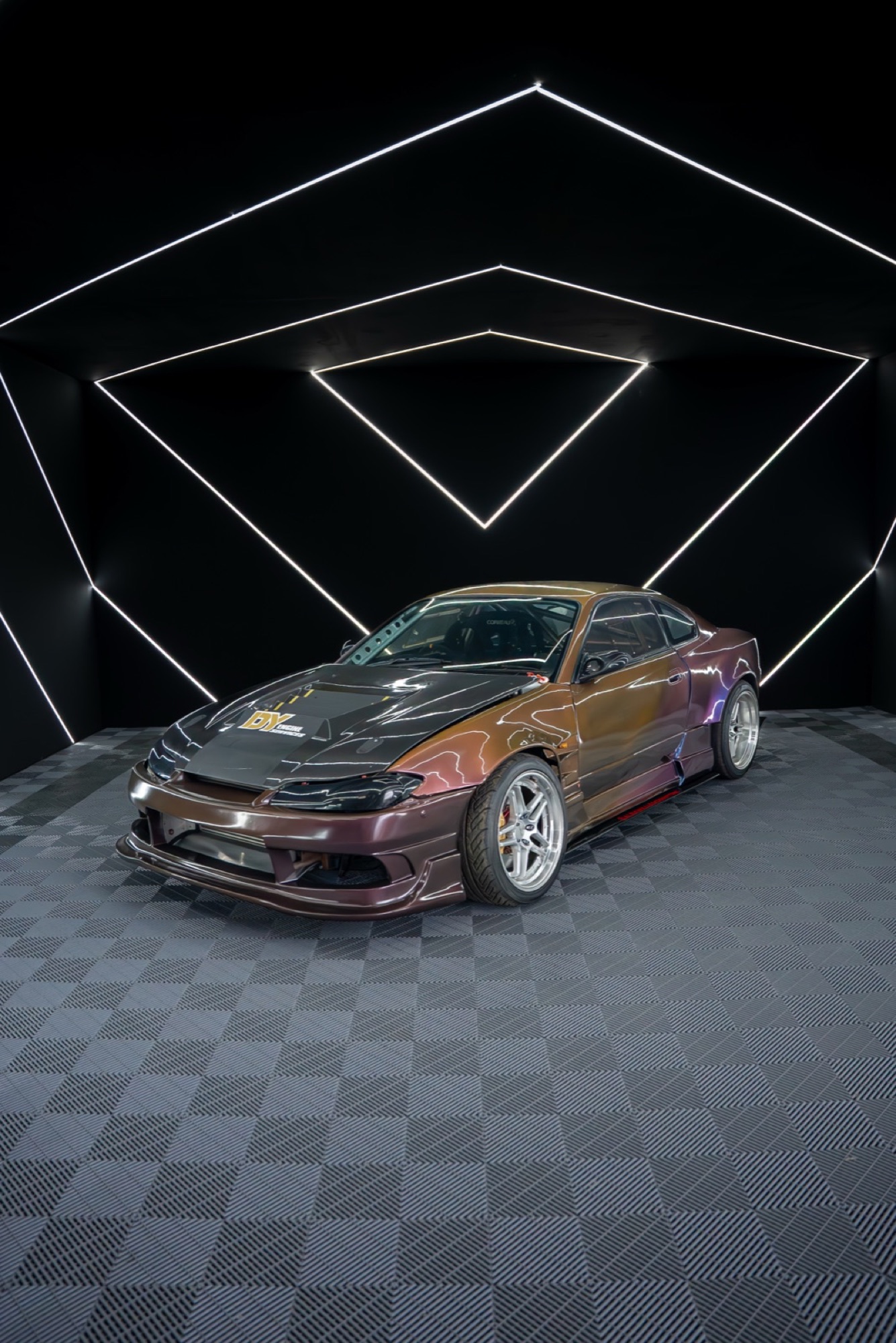 Nissan Silvia S15 in a black studio with LED triangles
