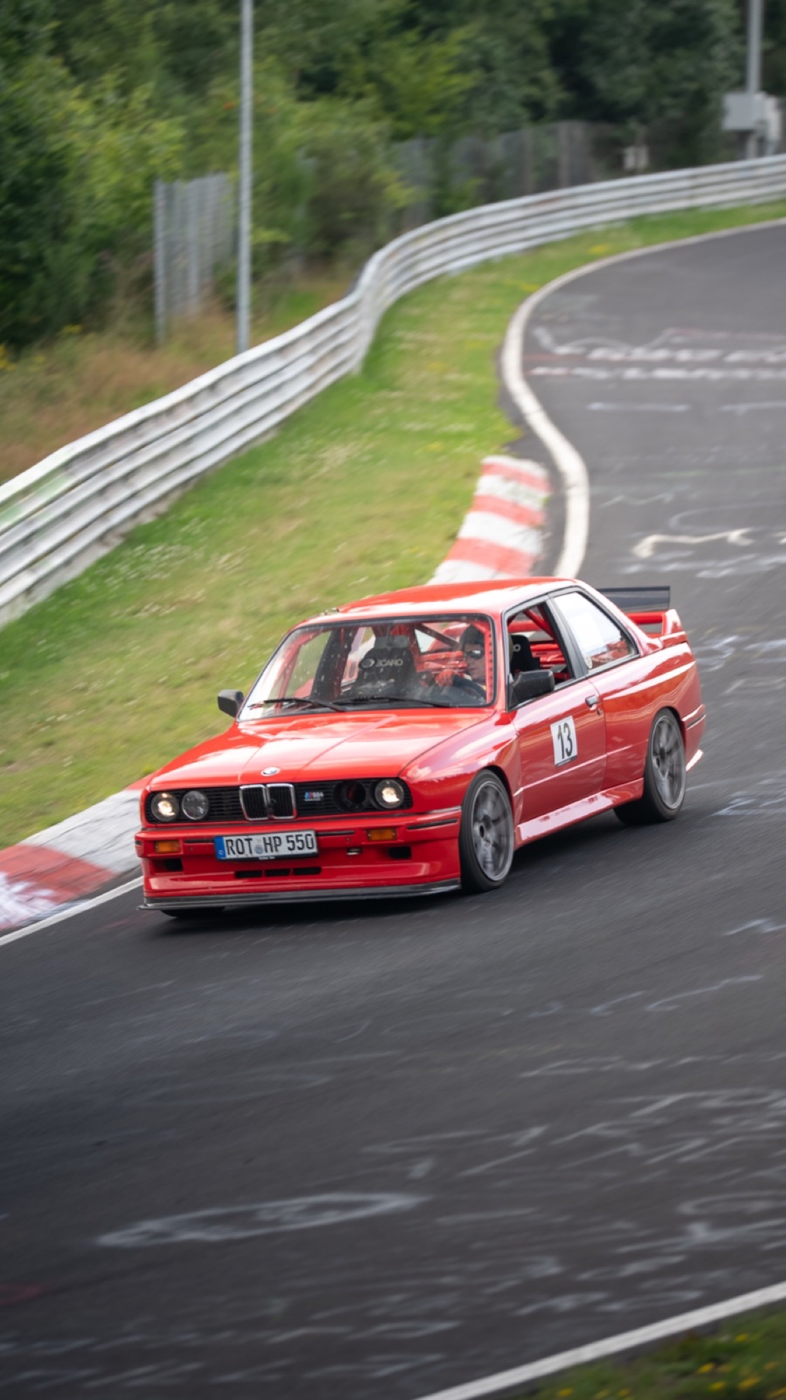 Red BMW E30 on the Nürburgring, number 13
